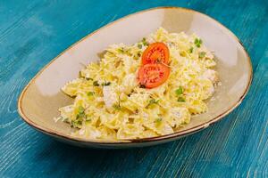 tasty farfalle pasta with parmesan cheese photo