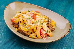 Fettuccine pasta with beef, chicken and parmesan photo