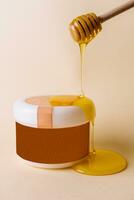 Honey drips into natural spa formula for skincare photo