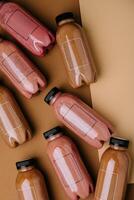 raspberry and chocolate smoothie cocktails in plastic bottles photo