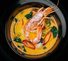 Tom yam is a spicy soup with shrimp. Restaurant soup food. photo