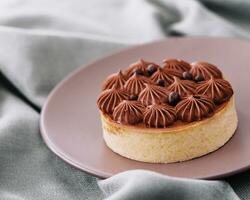 Chocolate cake on a ceramic plate photo