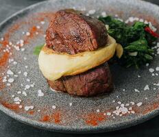 Filet mignon with mashed potatoes in a restaurant photo