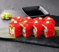 Sushi, rolls, California uramaki with tobiko caviar photo