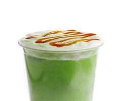 Plastic cup of fresh matcha latte photo