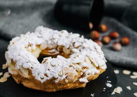 French traditional cake powdered sugar and almond petals photo