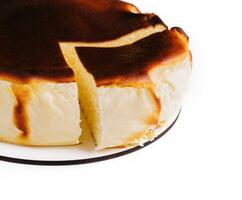 San sebastian cheesecake on plate isolated photo