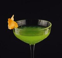 Apple martini coctail isolated on black background photo