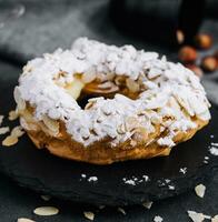 French traditional cake powdered sugar and almond petals photo