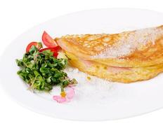 Omelette with ham cherry tomatoes on plate photo