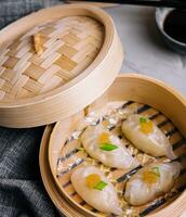 Steamed shrimp dumplings dim sum with pike caviar photo