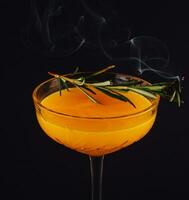 Rosemary cocktail - golden rum, rosemary, fruits juice and syrup photo