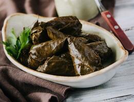 Dolma cabbage rolls grape leaves with filling photo