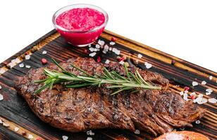 Grilled beef steak on wooden board photo