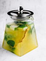 Passionfruit iced green tea or lemonade with lime and mint photo