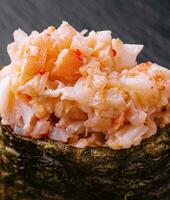 Gunkan sushi with spicy tuna close up photo