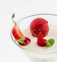 Italian dessert panna cotta with red fresh strawberries photo