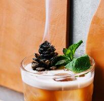 Cocktail with preserved sweet cedar cone photo