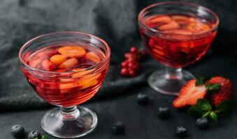 Strawberry jelly with fresh berries and peppermint photo