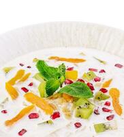 muesli with kiwi, apricot and pomegranate photo