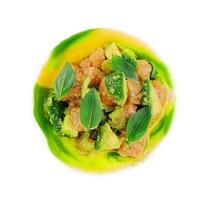 salmon with avocado and basil on white plate photo