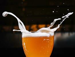 Glass of splashing beer close up photo