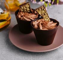 Chocolate cup cakes with tea pot photo