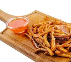 Delicious pork ears snack plate on white photo