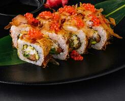 Sushi rolls with bonito flakes, tuna, cheese cream and cucumber photo