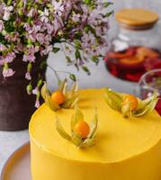 Tasty mango mousse cake on plate photo