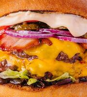 Bacon cheese burger with beef patty tomato onion photo