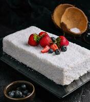 raffaello cake coconut almond cake with berries photo