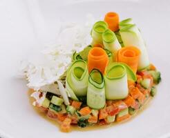 vegetable tartar of cucumber, carrot and tomato photo