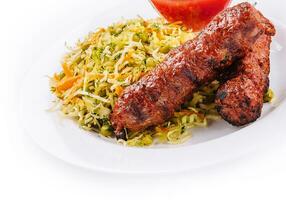 Moldavian Traditional Mititei Mici Meat Sticks with Cabbage and a Sauce photo