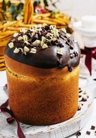 Round fragrant Easter bun with chocolate sprinkles photo