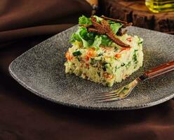 Couscous with vegetables served in plate photo