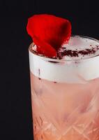 Clover club cocktail drink with raspberry and rose petal photo