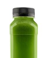 Bottle of spirulina smoothie on white background photo