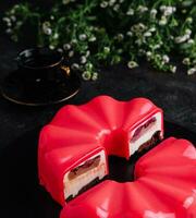 Multi layered raspberry mousse cake on plate photo