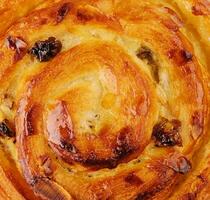 Homemade puff pastry bun with almond flakes photo