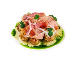 Salad with prosciutto and artichokes isolated photo