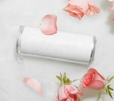 Wet metal aluminum beverage drink can with rose petals photo