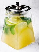 Iced green tea with lime and fresh mint photo