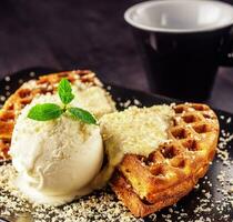 Ice cream with belgian waffles, fresh mint, vanila topping photo