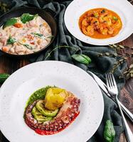 Octopus Sicilian, Salmon in cream sauce, Shrimp in Romesco sauce photo
