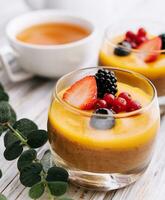 Delicious panna cotta with mango with berries photo