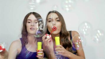 Blowing bubbles straight at the camera video