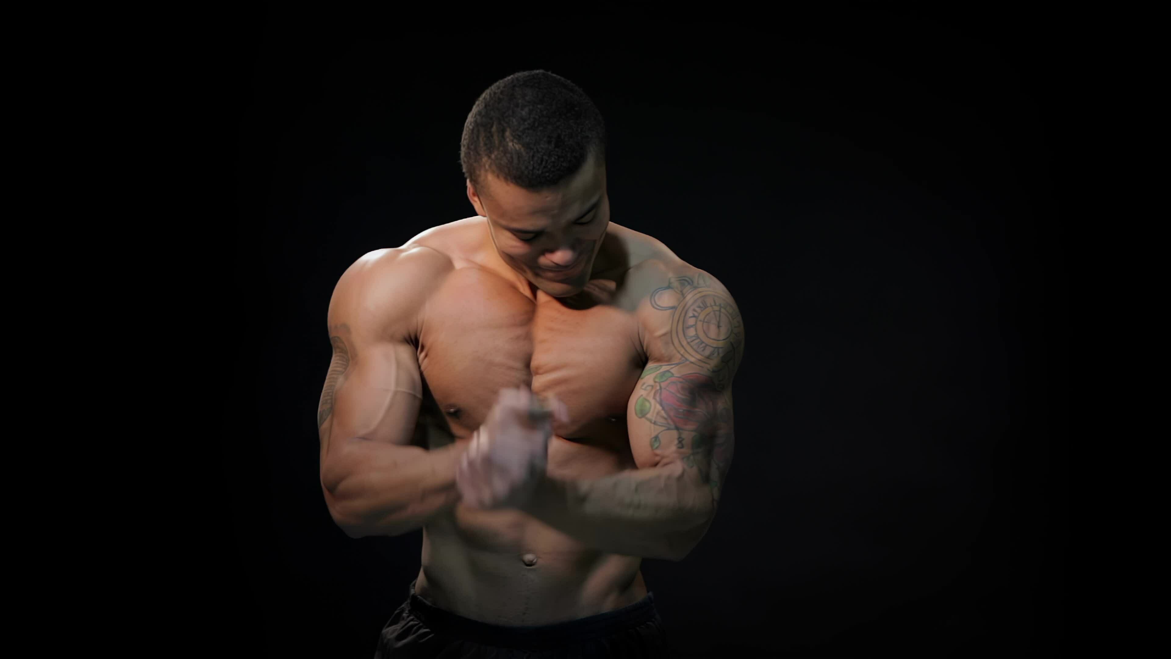 Male doing bodybuilding pose 31756884 Stock Video at Vecteezy