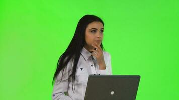 Young businesswoman having an idea, while working on a computer video