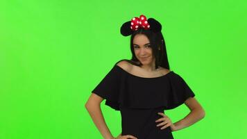 Beautiful woman wearing fluffy mouse ears posing playfully video